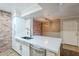 Kitchen sink and stone countertop island featuring stainless appliances and modern finishes at 2025 E Campbell Ave # 143, Phoenix, AZ 85016