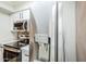 Stainless refrigerator in kitchen featuring white cabinets and stainless steel appliances at 2025 E Campbell Ave # 143, Phoenix, AZ 85016