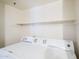 Laundry room features a white washer and dryer at 2025 E Campbell Ave # 143, Phoenix, AZ 85016