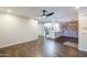 Open-concept living area with wood floors that connects to the modern kitchen at 2025 E Campbell Ave # 143, Phoenix, AZ 85016