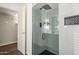 Modern bathroom features a glass-enclosed shower with sleek fixtures and subway tile at 2025 E Campbell Ave # 143, Phoenix, AZ 85016