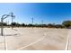 A well-lit basketball court for residents provides a space for recreation and exercise within the community at 2176 W Larissa Ln, San Tan Valley, AZ 85144