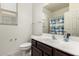 Bathroom featuring a white sink, cabinets, and a mirror over the sink at 2176 W Larissa Ln, San Tan Valley, AZ 85144