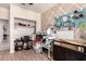 This craft room is full of light, crafting supplies and an open closet space at 2176 W Larissa Ln, San Tan Valley, AZ 85144