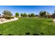 Well-manicured green space with walking path offers a serene and inviting outdoor experience for residents at 2176 W Larissa Ln, San Tan Valley, AZ 85144
