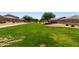 Manicured community greenspace with walking path and desert landscaping at 2176 W Larissa Ln, San Tan Valley, AZ 85144