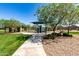 The community park offers a playground, covered seating and beautiful green landscaping at 2176 W Larissa Ln, San Tan Valley, AZ 85144