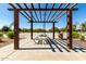 Shaded picnic area with a table and seating, offering a relaxing outdoor space near the basketball court at 2176 W Larissa Ln, San Tan Valley, AZ 85144