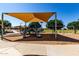 Modern playground with dual slides and sunshade offers outdoor fun for families in a secure environment at 2176 W Larissa Ln, San Tan Valley, AZ 85144
