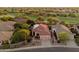 Aerial view of a home with solar panels in a golf course community at 22432 N 52Nd Pl, Phoenix, AZ 85054
