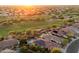 Aerial view of homes with pools in a golf course community at 22432 N 52Nd Pl, Phoenix, AZ 85054