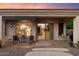 Back patio featuring outdoor seating under a retractable awning with views of the kitchen and dining room at 22432 N 52Nd Pl, Phoenix, AZ 85054
