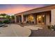 Covered backyard patio and outdoor seating area next to a swimming pool at 22432 N 52Nd Pl, Phoenix, AZ 85054
