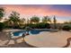 Relaxing backyard pool and spa with lush desert landscaping at 22432 N 52Nd Pl, Phoenix, AZ 85054