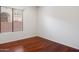 Bright bedroom featuring wood floors and a large window, creating a serene and inviting space at 22432 N 52Nd Pl, Phoenix, AZ 85054