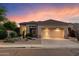 Charming single-story home with desert landscaping and a two-car garage at 22432 N 52Nd Pl, Phoenix, AZ 85054