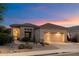 Charming single-story home with desert landscaping and a two-car garage at 22432 N 52Nd Pl, Phoenix, AZ 85054