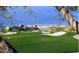 Expansive golf course view, showcasing lush green fairways and manicured sand traps at 22432 N 52Nd Pl, Phoenix, AZ 85054
