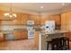 Bright kitchen featuring granite counters and seating at island at 22432 N 52Nd Pl, Phoenix, AZ 85054