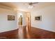 Elegant living room featuring wood floors and neutral walls, offering ample space for personalization at 22432 N 52Nd Pl, Phoenix, AZ 85054