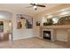 Inviting living room featuring a fireplace and ample natural light at 22432 N 52Nd Pl, Phoenix, AZ 85054