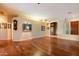 Open-concept living room with hardwood floors and neutral paint at 22432 N 52Nd Pl, Phoenix, AZ 85054