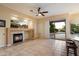Living area featuring a fireplace and backyard access at 22432 N 52Nd Pl, Phoenix, AZ 85054