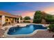 Backyard pool featuring desert landscaping and lighting in a fenced backyard with an Arizona sunset at 22432 N 52Nd Pl, Phoenix, AZ 85054