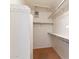 Functional walk-in closet with built-in shelving and ample storage space for organization at 22432 N 52Nd Pl, Phoenix, AZ 85054