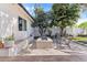 Beautiful backyard patio with a decorative fire pit, comfortable seating, and a built-in bench for a relaxing outdoor experience at 2316 N 81St St, Scottsdale, AZ 85257