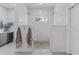 A luxurious walk-in shower with dual showerheads, a mosaic floor, and a built-in bench at 2316 N 81St St, Scottsdale, AZ 85257