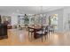 Open-concept dining area with a large wooden table, stylish chairs, and seamless transition to the inviting living room at 2316 N 81St St, Scottsdale, AZ 85257