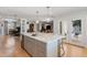 Spacious kitchen island with marble countertop, seating, and storage, connecting to other living spaces for open-concept living at 2316 N 81St St, Scottsdale, AZ 85257