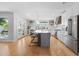 Bright, open kitchen with a large island, seating, modern appliances, and backyard views, perfect for Gathering gatherings at 2316 N 81St St, Scottsdale, AZ 85257
