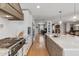 Contemporary kitchen featuring white cabinetry, a central island, and stainless steel appliances for functionality and style at 2316 N 81St St, Scottsdale, AZ 85257