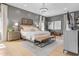 This spacious main bedroom boasts neutral tones, a plush bed, and a stylish chandelier for elegant relaxation at 2316 N 81St St, Scottsdale, AZ 85257