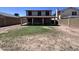 The spacious backyard features a covered patio and views of the home's exterior at 23833 N 36Th Dr, Glendale, AZ 85310