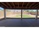 This covered patio offers a view of the spacious backyard, perfect for outdoor enjoyment at 23833 N 36Th Dr, Glendale, AZ 85310