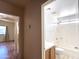 Main bathroom with updated sink, shower-tub combo and neutral finish at 23833 N 36Th Dr, Glendale, AZ 85310