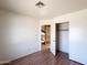 Well-lit bedroom with laminate floors and double closet at 23833 N 36Th Dr, Glendale, AZ 85310