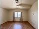 Bedroom featuring hard surface flooring, a window and neutral colored curtains at 23833 N 36Th Dr, Glendale, AZ 85310