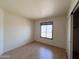 This bedroom features neutral walls, wood-look flooring and a window for natural light at 23833 N 36Th Dr, Glendale, AZ 85310