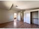 Spacious bedroom with wood-look floors, ensuite bath and double closet with shelf and rail storage at 23833 N 36Th Dr, Glendale, AZ 85310