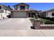 Charming two-story home features a brick facade, a two-car garage, and well-maintained landscaping at 23833 N 36Th Dr, Glendale, AZ 85310