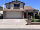 Charming two-story home features a brick facade, a two-car garage, and well-maintained landscaping at 23833 N 36Th Dr, Glendale, AZ 85310