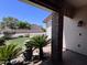 Inviting front porch with brick accents and lush landscaping creates a welcoming entrance at 23833 N 36Th Dr, Glendale, AZ 85310
