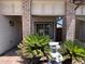Inviting front porch with brick accents and lush landscaping creates a welcoming entrance at 23833 N 36Th Dr, Glendale, AZ 85310