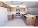 Well-lit kitchen featuring stainless steel appliances, ample storage and white countertops at 23833 N 36Th Dr, Glendale, AZ 85310