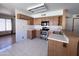 Bright kitchen featuring stainless steel appliances, ample cabinets and tile flooring at 23833 N 36Th Dr, Glendale, AZ 85310