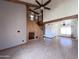 Spacious living room boasts wood floors, wood beams, and a staircase, offering a warm and inviting atmosphere at 23833 N 36Th Dr, Glendale, AZ 85310